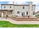 Backyard featuring a large deck, covered outdoor dining area, built in grill, and well-manicured lawn at 250 W Tansey Crossing, Westfield, IN 46074