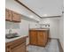 Finished basement bar area features tile floors, vintage cabinetry and lots of charm at 250 W Tansey Crossing, Westfield, IN 46074