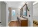 Bathroom featuring double vanities, granite countertops, and a tiled shower at 250 W Tansey Crossing, Westfield, IN 46074