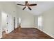 Bright, airy bedroom features wood-look floors, a ceiling fan, and an ensuite bathroom entrance at 250 W Tansey Crossing, Westfield, IN 46074