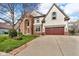 Two-story home featuring a brick exterior, well-manicured lawn, and attached garage at 250 W Tansey Crossing, Westfield, IN 46074