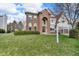 Beautiful brick home features a manicured lawn and attached two-car garage at 250 W Tansey Crossing, Westfield, IN 46074
