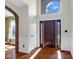 Inviting foyer with hardwood floors, wainscoting, and a beautiful front door with sidelights at 250 W Tansey Crossing, Westfield, IN 46074