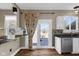Well-lit kitchen features stainless steel appliances, granite counters, and hardwood floors at 250 W Tansey Crossing, Westfield, IN 46074