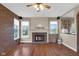 Spacious living room features hardwood floors, a brick fireplace, and large windows at 250 W Tansey Crossing, Westfield, IN 46074