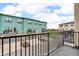 Balcony view of townhomes with garage parking in a community with green space at 2578 Filson St, Carmel, IN 46032