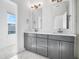 Modern bathroom features double vanity, large mirrors and granite countertop at 2578 Filson St, Carmel, IN 46032