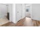 Bathroom doorway view, featuring modern vanity and shower, and wood-style flooring at 2578 Filson St, Carmel, IN 46032