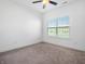 Bedroom featuring carpet, a ceiling fan, and a window with blinds, offering a cozy and well-lit space at 2578 Filson St, Carmel, IN 46032