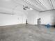 Garage with concrete floors and ample space for parking and storage, equipped with modern utilities at 2578 Filson St, Carmel, IN 46032