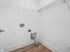 Laundry room equipped with shelving and utility connections, offering a practical and organized space at 2578 Filson St, Carmel, IN 46032