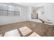 Bright living room with wood floors, large windows, and open staircase at 2578 Filson St, Carmel, IN 46032