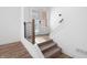 Modern staircase featuring wood and metal, complemented by lots of natural light at 2578 Filson St, Carmel, IN 46032