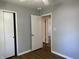This bedroom has neutral walls, closet, ceiling fan and a view into another room at 2843 Canterbury Ln, Indianapolis, IN 46220
