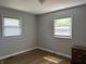 Bright bedroom features hardwood floors and two windows providing plenty of natural light at 2843 Canterbury Ln, Indianapolis, IN 46220