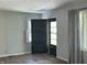 Charming entryway showcases the front door, leading into a light-filled home at 2843 Canterbury Ln, Indianapolis, IN 46220