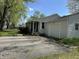 Charming home with a covered front porch and attached garage, surrounded by a well-maintained yard at 2843 Canterbury Ln, Indianapolis, IN 46220
