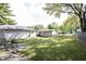 A spacious backyard with lush green grass and shade, offering a serene outdoor space at 2909 Huntsville Rd, Pendleton, IN 46064