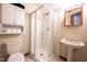 Well-lit bathroom featuring a walk-in shower and pedestal sink at 2909 Huntsville Rd, Pendleton, IN 46064