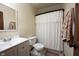 Bathroom featuring a vanity with sink, toilet, and shower with patterned curtain at 2909 Huntsville Rd, Pendleton, IN 46064