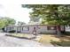 Well-maintained single-story home featuring a detached garage and tidy front yard at 2909 Huntsville Rd, Pendleton, IN 46064
