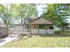 Charming home featuring a welcoming front porch and meticulously maintained landscaping at 2909 Huntsville Rd, Pendleton, IN 46064