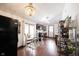 Bright kitchen with wood floors, stainless steel appliances, breakfast nook, and stylish chandelier at 2909 Huntsville Rd, Pendleton, IN 46064