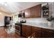 Kitchen with wooden cabinets, stainless steel appliances, and a breakfast nook with bay window at 2909 Huntsville Rd, Pendleton, IN 46064