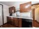 Kitchen with wooden cabinets, stainless steel appliances, and light countertops with a double sink at 2909 Huntsville Rd, Pendleton, IN 46064