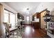 Bright eat-in kitchen featuring a bay window, wooden cabinetry, and stainless steel appliances at 2909 Huntsville Rd, Pendleton, IN 46064