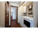 Laundry area with washer and dryer; shelving and storage cabinets above at 2909 Huntsville Rd, Pendleton, IN 46064