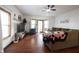 Bright living room with hardwood floors, a ceiling fan, and a comfortable sectional at 2909 Huntsville Rd, Pendleton, IN 46064