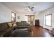 Comfortable living room featuring hardwood floors, a ceiling fan, and a large sectional sofa at 2909 Huntsville Rd, Pendleton, IN 46064