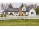 Beautifully landscaped backyard with lush green grass and white picket fence provides a serene and private outdoor oasis at 311 2Nd Ne St, Carmel, IN 46032