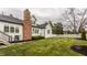 Lush green backyard with meticulously landscaped areas, offering a tranquil and private outdoor retreat at 311 2Nd Ne St, Carmel, IN 46032