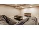 Spacious basement area, features a comfy lounge area and neutral decor, ideal for recreation at 311 2Nd Ne St, Carmel, IN 46032