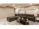 Expansive basement area showcasing a comfortable sectional couch, coffee table, and neutral carpeting at 311 2Nd Ne St, Carmel, IN 46032