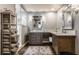 Luxurious bathroom features double vanity, a glass shower and custom shelving with plush rolled towels at 311 2Nd Ne St, Carmel, IN 46032