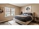 Bedroom with a natural light, features a dark blue color scheme, and is decorated with decorative pieces at 311 2Nd Ne St, Carmel, IN 46032