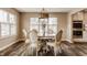 Cozy dining room featuring a round table, chairs, and views of the backyard at 311 2Nd Ne St, Carmel, IN 46032