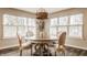 Bright dining area with a round table, comfortable chairs, and ample natural light at 311 2Nd Ne St, Carmel, IN 46032