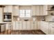 Elegant kitchen boasts custom cabinetry, stainless steel appliances, and natural light at 311 2Nd Ne St, Carmel, IN 46032