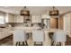Spacious kitchen with a large island, designer lighting, and stainless steel appliances at 311 2Nd Ne St, Carmel, IN 46032