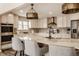 Modern kitchen featuring quartz countertops, stainless steel appliances, and custom cabinetry at 311 2Nd Ne St, Carmel, IN 46032