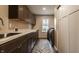 Well-equipped laundry room with modern appliances, ample counter space, and cabinetry at 311 2Nd Ne St, Carmel, IN 46032