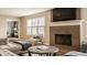 Cozy living room featuring a fireplace and large window at 311 2Nd Ne St, Carmel, IN 46032