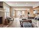 Open-concept living space with fireplace, dining area, and comfortable sectional sofa at 311 2Nd Ne St, Carmel, IN 46032