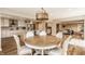 Spacious open concept with kitchen and dining area illuminated by modern lighting at 311 2Nd Ne St, Carmel, IN 46032