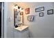 Bathroom featuring a vanity with a mirror, towels, and decorative wall art at 3142 N Euclid Ave, Indianapolis, IN 46218