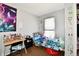 Bedroom with a window and decorated walls at 3142 N Euclid Ave, Indianapolis, IN 46218